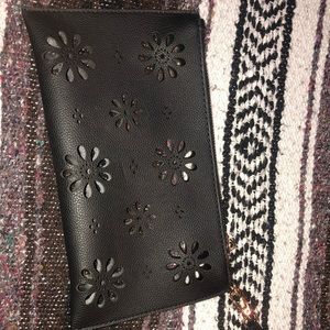 Black wristlet with cutouts